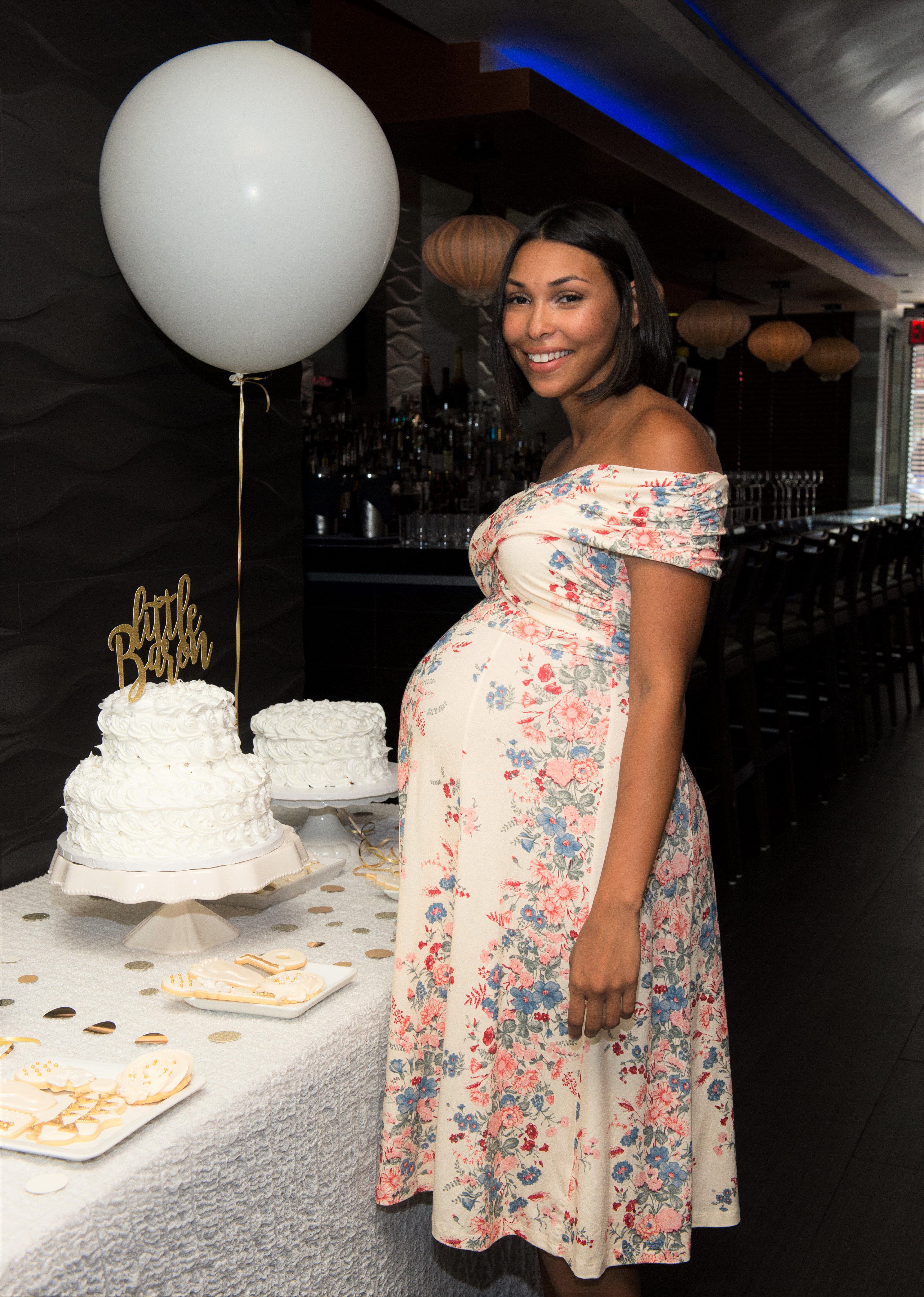 white and gold baby shower outfit