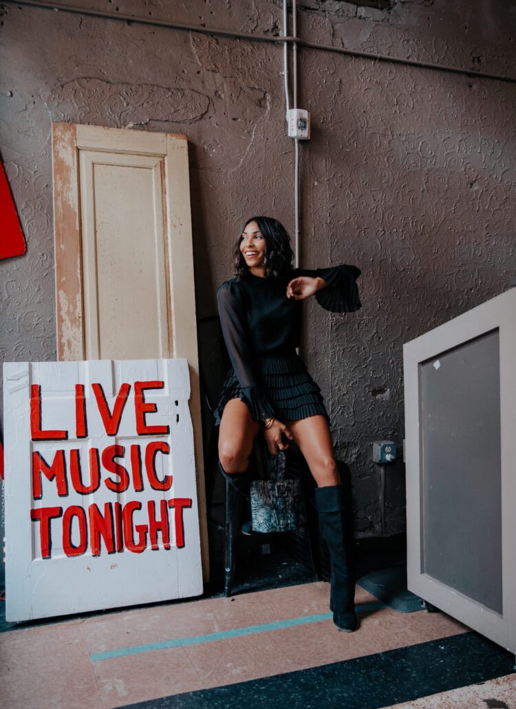 Woman in black dress, live music tonight.