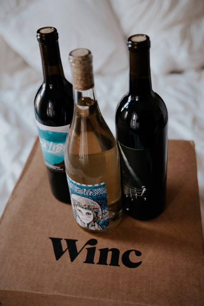 Winc wine delivery box with three bottles.