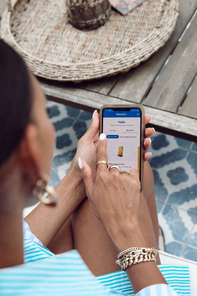 Woman views Walmart+ app benefits.